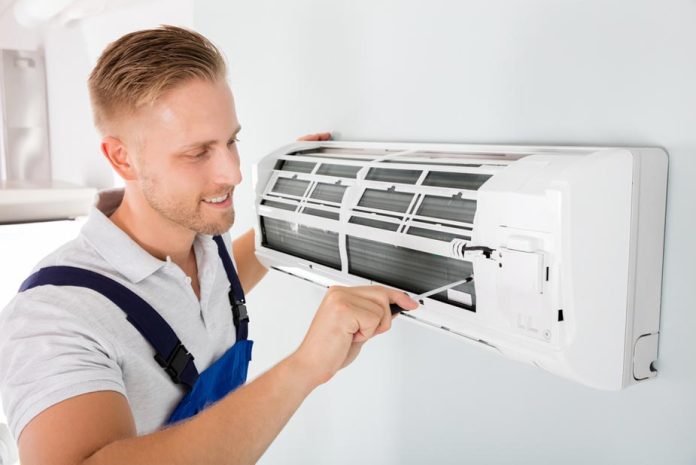 man doing hvac air conditioner service