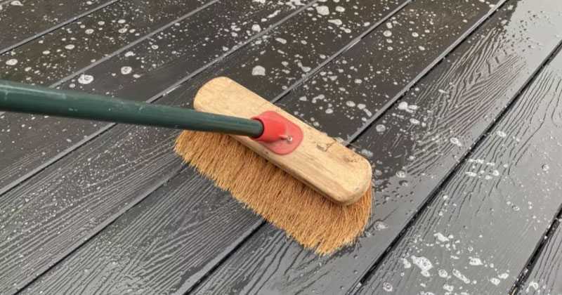 Cleaning composite decking using a power washer